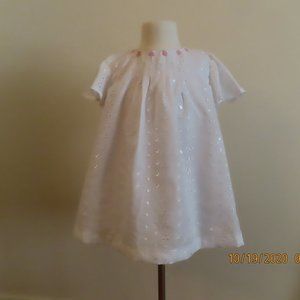 White lined, eyelet toddler dress with detailed with pink flowers.  Size 4T